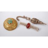 A Victorian pinchbeck turquoise set convex brooch, with filigree work detail, 3.5cm; together with a