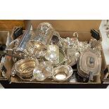 A box of miscellaneous silver plated wares, to include bottle sleeve, card waiter, bottle coaster,