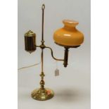 A Victorian brass desk lamp, having rise-and-fall action and opaque glass shade (later converted for