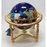 A modern brass framed and hardstone inset terrestrial table-top globe, approx h.52cm