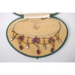 A George V white metal, amethyst, seed pearl and marcasite set necklet, arranged as three round