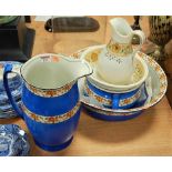 An early 20th century wash jug and bowl with matching chamberpot; together with another smaller wash