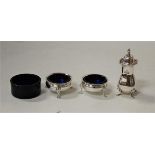 A pair of Edwardian silver table salts, with blue glass liners, by the Goldsmiths & Silversmiths