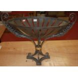 A modern wrought iron twin handled planter, of oval form, on platform base, w.69cm