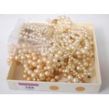 Assorted faux pearl necklaces; together with a cultured necklace with paste set clasp etc