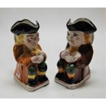 A pair of Staffordshire style Toby jugs