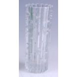 A 1960s clear moulded art glass vase, of cylindrical form, with outer raised geometric stylised