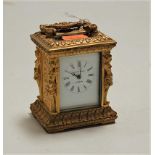 A 20th century gilt metal cased miniature carriage timepiece, having enamelled dial with Roman