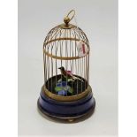 A Victorian style singing bird in cage clockwork automata, h.31cmCondition report: Currently in