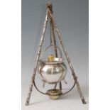An Arts & Crafts silver plated cauldron on stand, after a design by Christopher Dresser, the