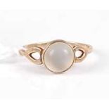 A yellow metal and moonstone set ring, unmarked but tests as approx 9ct, 1.4g, size J