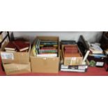 Seven boxes of miscellaneous books, to include the works of Dickens, Places to Visit in Britain,