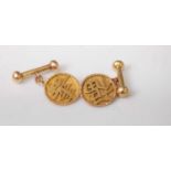 A pair of Chinese 18ct gold dumbbell cufflinks, 5.9g