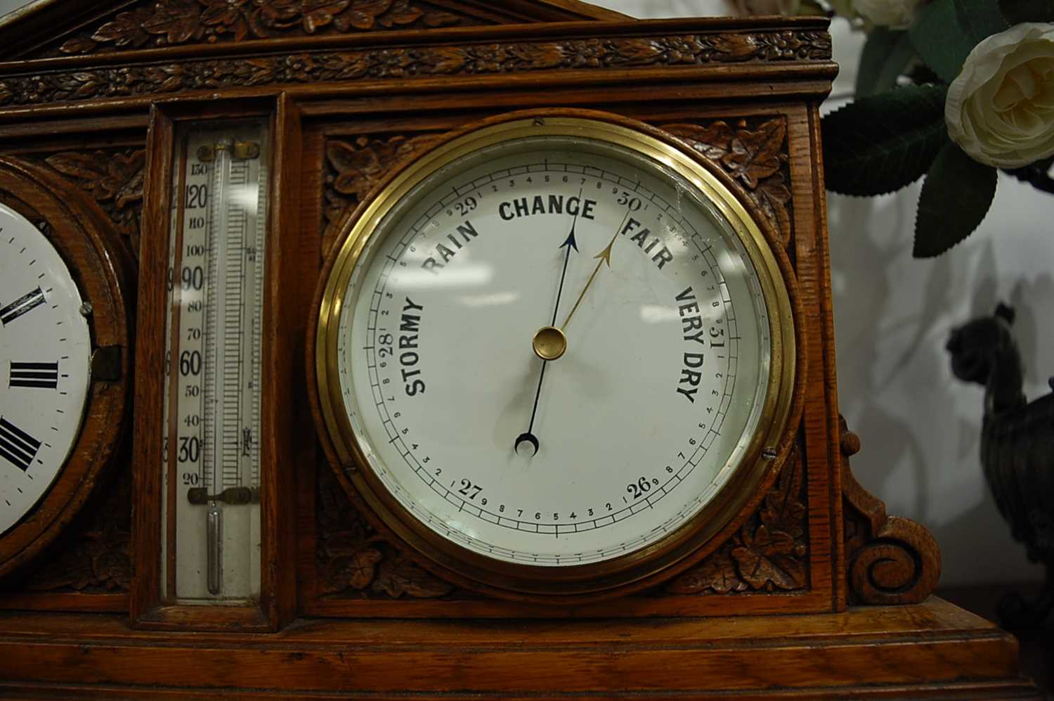 A Victorian carved oak desk weather station, inset with clock and barometer, with central - Image 8 of 9