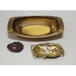 A WMF polished brass dish, with floral embossed ends, w.34cm; together with a cast brass ashtray and