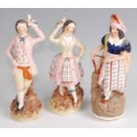 A pair of 19th century Staffordshire pearlware figures, in the form of a lady and gent each in