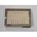 A Tiffany & Co silver plated desk calendar, with velvet pouch and card box, w.11cmCondition