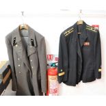 A Russian naval overcoat; together with a Russian naval dress jacket; two naval caps and a boxed