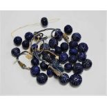 A collection of carved lapis lazuli beads, the largest approx 2.5cm