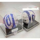 An Ipswich Town Match Sponsor football, bearing various signatures in black ink, housed in a perspex