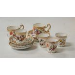 A set of four Dresden porcelain coffee cans and saucers, each decorated with floral sprays; together