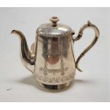 A late 19th century Russian silver bachelors coffee pot, of conical form with engraved decoration,