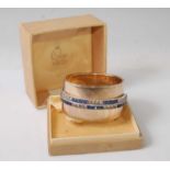 A Ciro gilt metal and paste set hinged bangle, in original fitted box