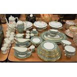 A Wedgwood bone china six place setting tea and dinner service, on a green ground within floral