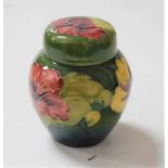 A Moorcroft pottery jar and cover, decorated in the Hibiscus pattern, impressed Moorcroft verso,