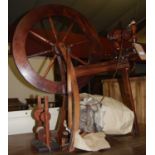 A stained beech spinning wheel