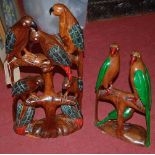 Two contemporary African carved hardwood figural groups of parrots, the largest h.60cm