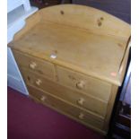 A Victorian pine three-quarter gallery backed chest, of two short over two long drawers, raised on