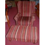 A contemporary striped upholstered wingback armchair, raised on beech cabriole forelegs, w.75cm;