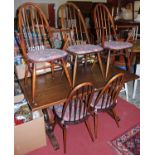 An early 20th century oak trestle end dining table, length 151cm; together with a set of five