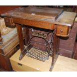 An early 20th century Singer sewing machine table, having hinged action, w.86cmCondition report: