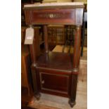 A late 19th century French mahogany, brass mounted, and further inlaid two-tier side cupboard,