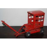 A Triang Toys large-scale pressed steel model of a four-wheel crane, finished in red (a/f)