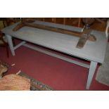 A contemporary grey painted beech plank topped farmhouse dining table, having cleated ends and on