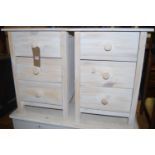 A pair of contemporary white-washed pine three drawer bedside chests, w.43cm