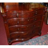 A mid-Victorian mahogany and flame mahogany serpentine front chest, of two short over three long