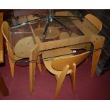 A contemporary breakfast suite, comprising; heavy glass topped round cornered table on plywood base,