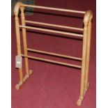 A turned pine towel rail, w.65cm