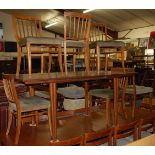 Gordon Russell (1892-1980) - a late 1950s walnut dining suite, comprising extending dining table