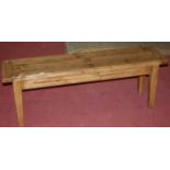 A contemporary rustic style stained pine long bench, length 133cm