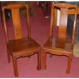 A set of six contemporary Chinese hardwood panelled seat splatback dining chairs