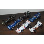 A collection of loose Corgi Toys Formula 1 related diecast vehicles and accessories, to include a