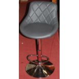 A set of three contemporary leather and chrome breakfast bar stools, having rise-and-fall action