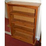 A modern pine round cornered freestanding open bookshelf, w.87cm