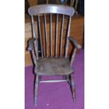 An early 20th century elm and beech stickback farmhouse open armchair, w.57cm