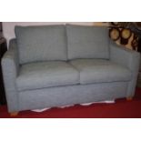 A contemporary fabric upholstered two-seater sofabed, w.158cm